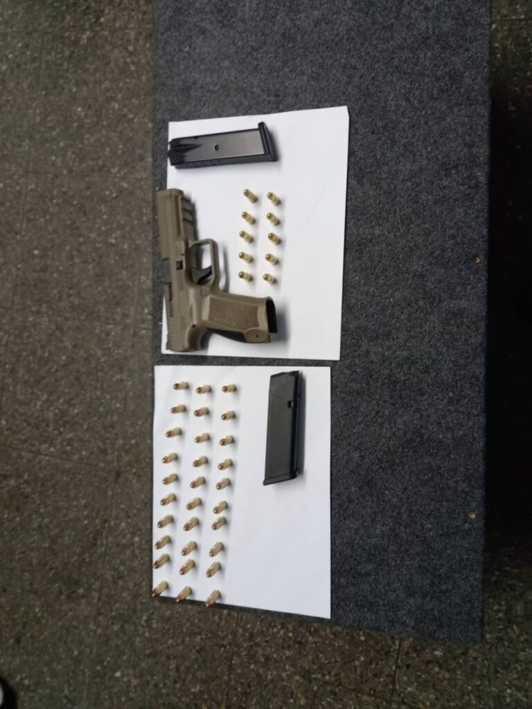 A gun and ammunition that were seized by police in San Juan and Malick during a series of overnight exercises. 
PHOTO COURTESY TTPS - 