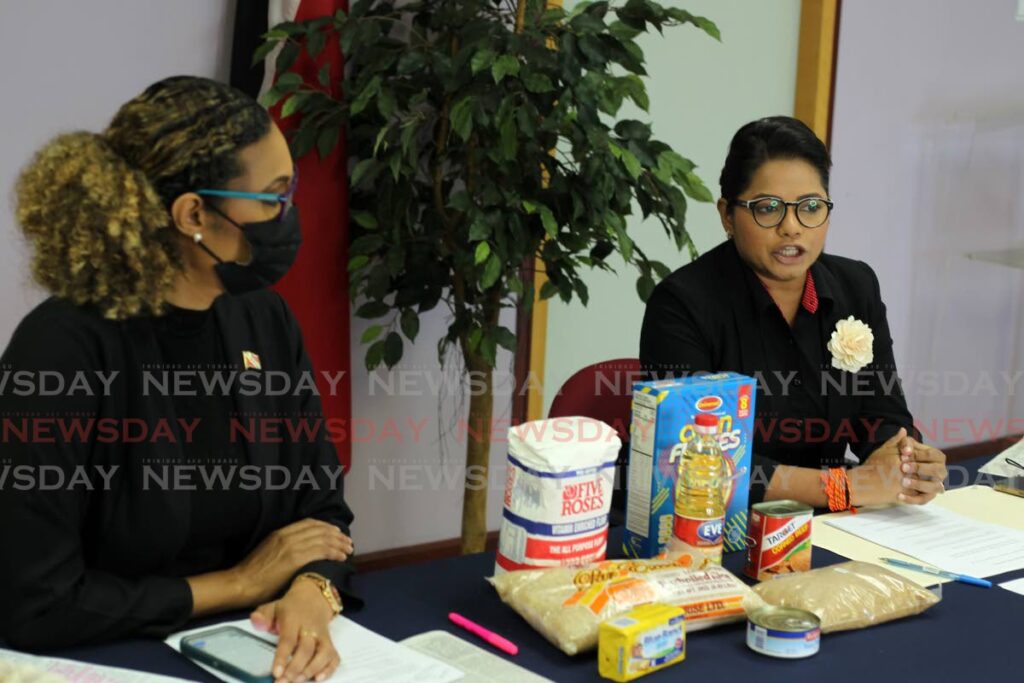 FOOD FOR THOUGHT: St Augustine MP Khadijah Ameen, left, and Chaguanas East MP Vandana Mohit at a press conference on Sunday at the Office of the Opposition Leader, Charles Street, Port of Spain.  Photo by Roger Jacob