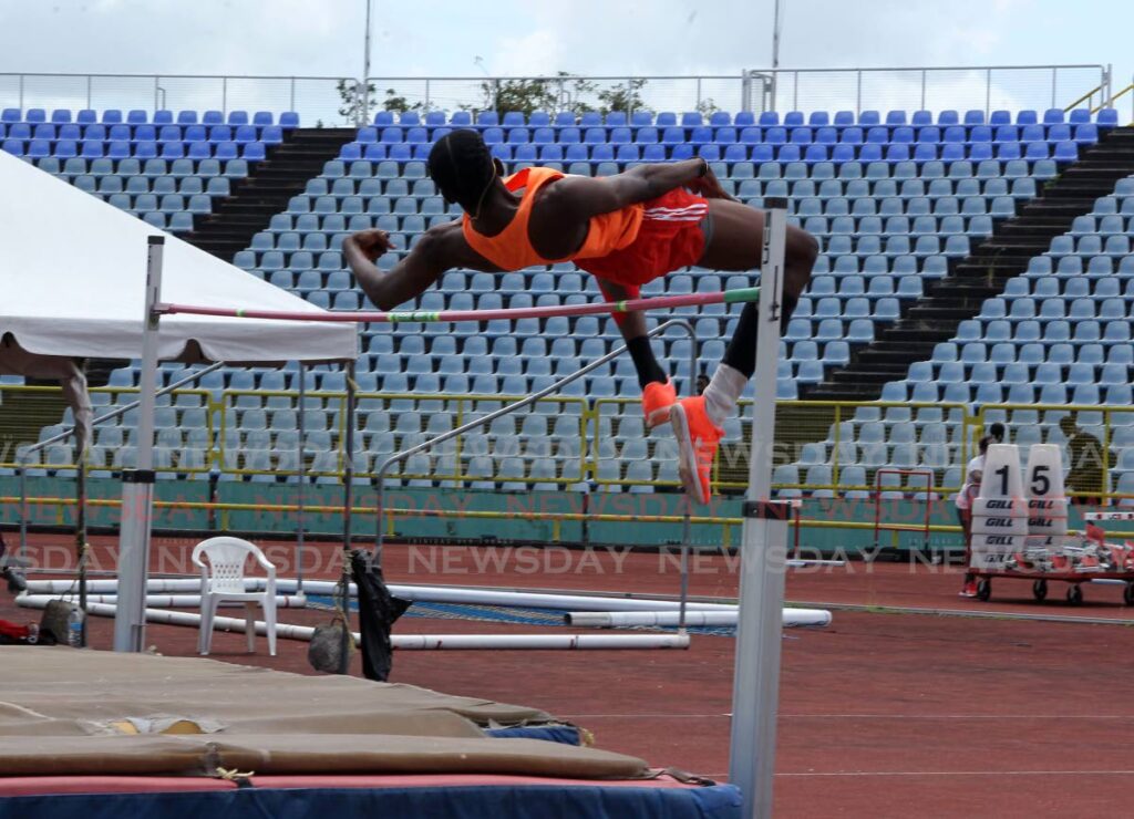 Neon Wolves’ Aaron Antoine, clears the bar in the Under-20 high jump, at the National Assocaition of Athletics Administration’s trials, on Sunday, at the Hasely Crawford Stadium, Port of Spain. - ROGER JACOB