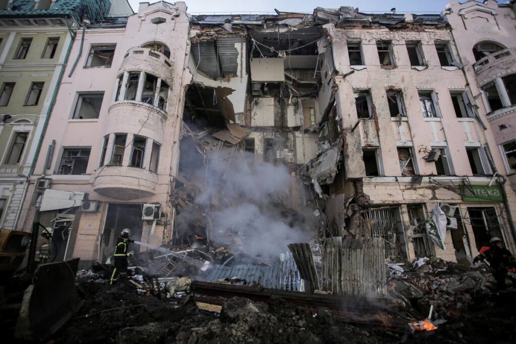 Firefighters extinguish an apartment house after a Russian rocket attack in Kharkiv, Ukraine's second-largest city, Ukraine, Monday. AP PHOTO - 
