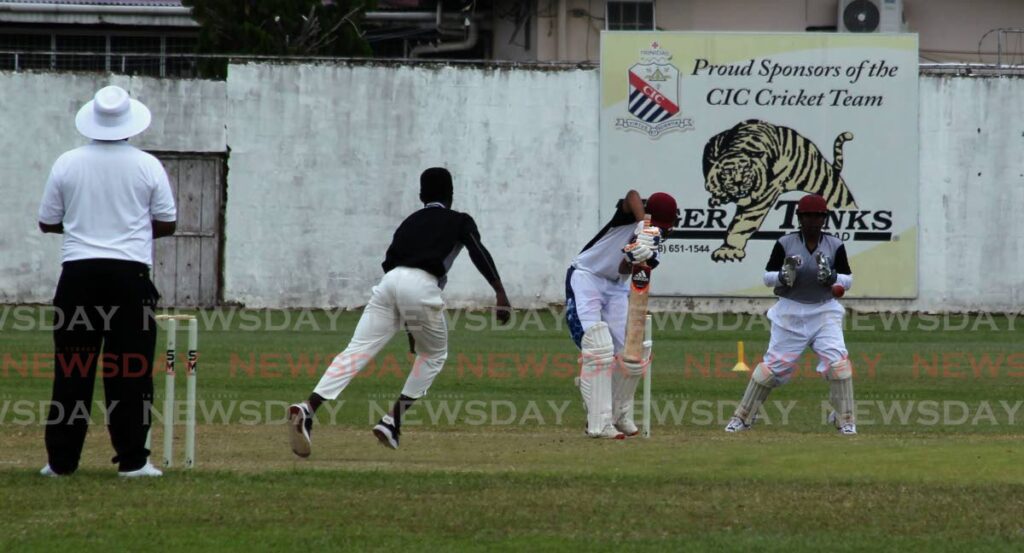 North East Zone bowler Aidan Owen, 2nd left, makes a delivery to Noth Zone’s Varisht Ramdeen during their match, on Monday, at St Mary’s Grounds, Port of Spain, during the Soctiabank NextGen U15 Development Programme match.  - ROGER JACOB