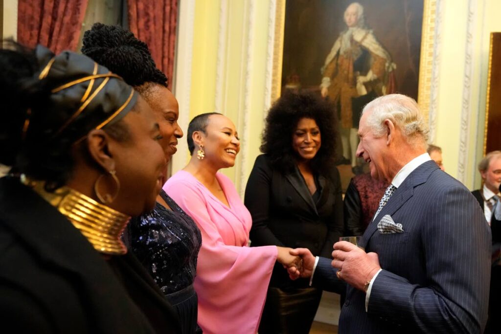 Britain's Prince Charles, the Prince of Wales, right, shakes hands with British singer-songwriter Emeli Sande at the annual Commonwealth Day Reception which traditionally takes place on Commonwealth Day at Marlborough House, the home of the Commonwealth Secretariat in London, Monday. AP PHOTO - 