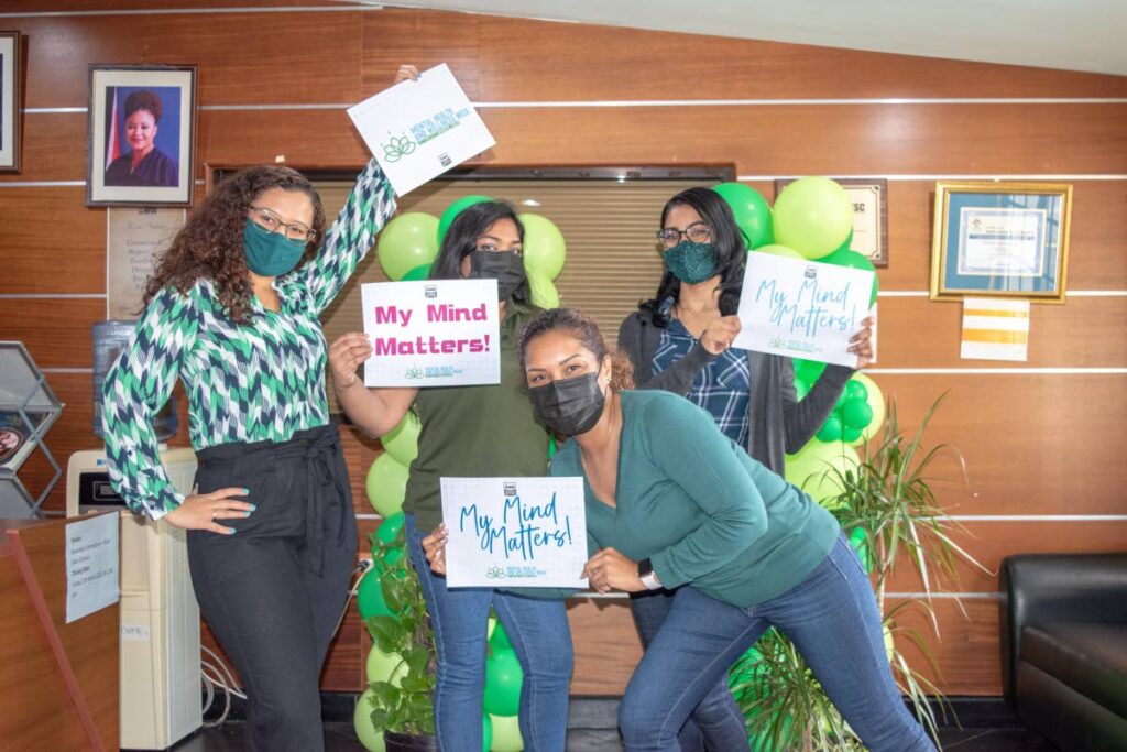 NESC marketing and corporate communications staffers share a message that mental health matters. Photo courtesy NESC - 
