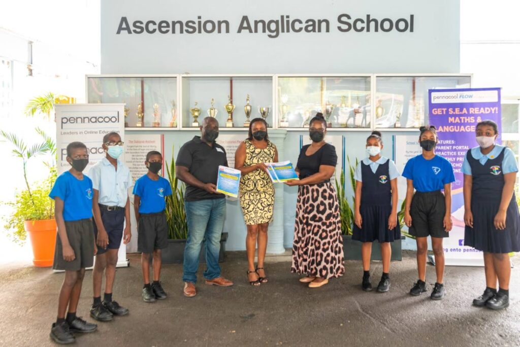 Flow’s communications manager Yolande Agard-Simmons (fourth from right) presents the sponsored booklets to Janelle Forrester-Warner of Ascension Anglican Primary School; alongside Phaessuh Kromah (technical director and co-founder of pennacool.com) (3rd from left) - 