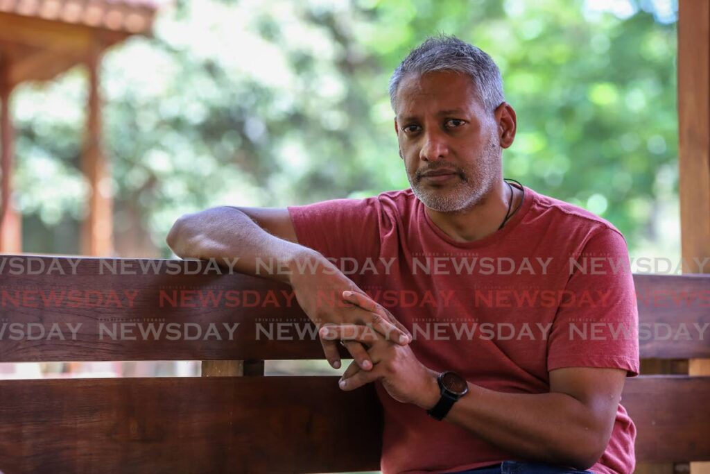 Former agriculture minister Clarence Rambharat in an interview at the Botanic Gardens, Port of Spain. - JEFF K MAYERS