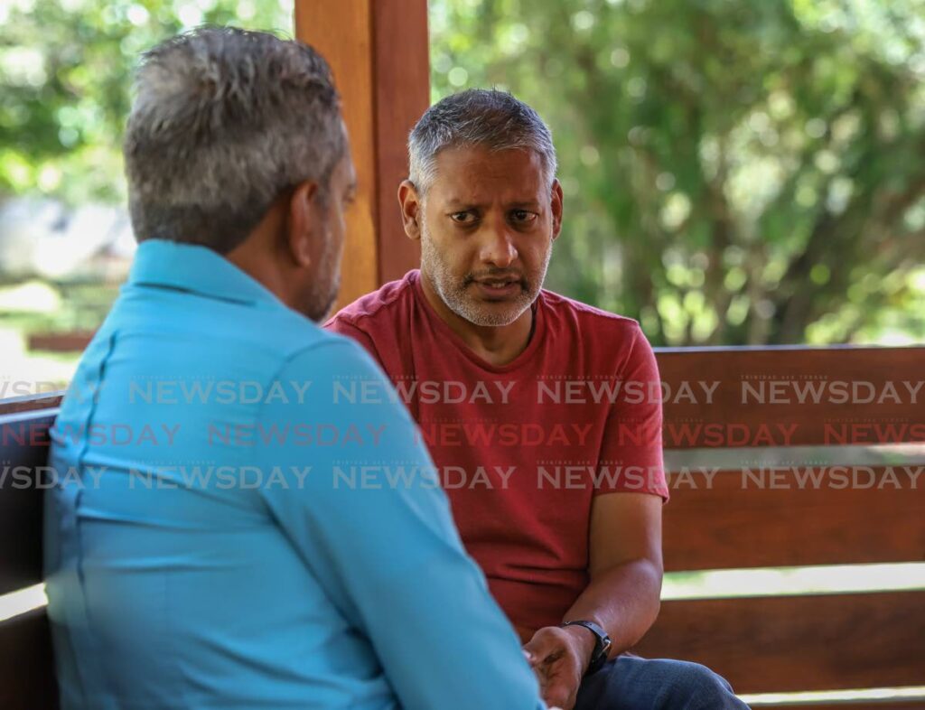 Former minister of Agriculture, Land and Fisheries Clarence Rambharat talks with Newsday's Darren Bahaw in the Royal Botanical Gardens, Port of Spain - JEFF K MAYERS