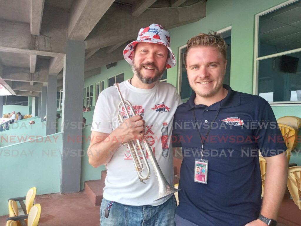 Managing director of Barmy Army Chris Millard,right, along with Barmy Army trumpeter Simon Finch during the second day of the second Test match between England and the West Indies, on Thursday, at Kensington Oval, Bridgetown, Barbados.  - Jelani Beckles