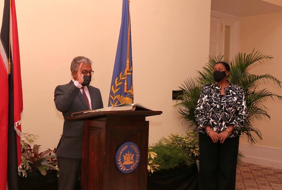 Senior Counsel Reginald Armour is sworn in as Attorney General at President's House on Wednesday. - COURTESY THE OFFICE OF THE PRESIDENT