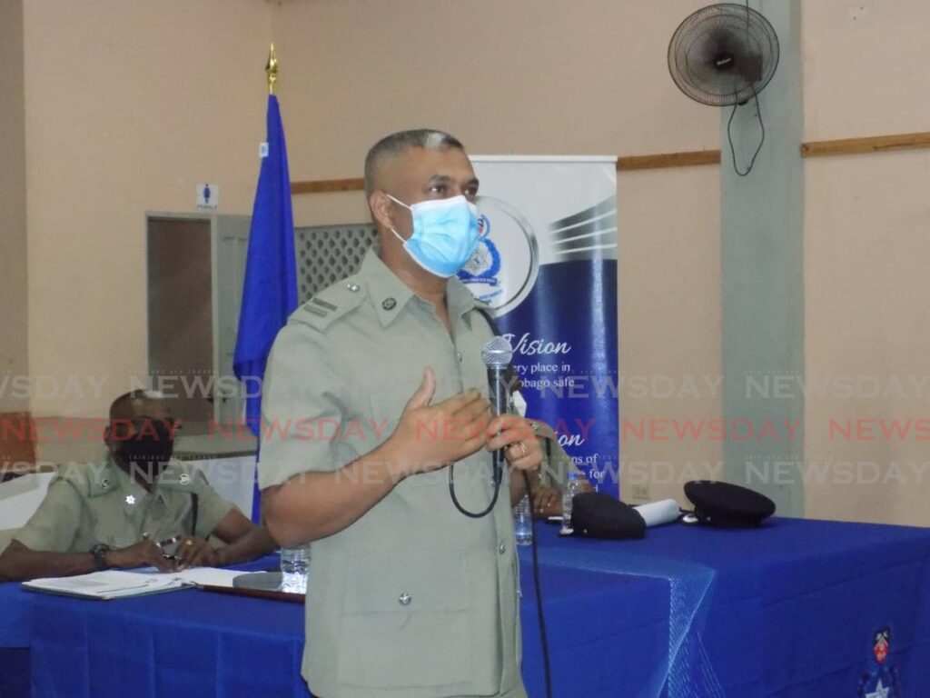 Legal officer for the North Eastern Division Insp Harripersad speaks to residents during a town hall meeting at the Aranguez Community Centre, on Thursday afternoon.  - Shane Superville