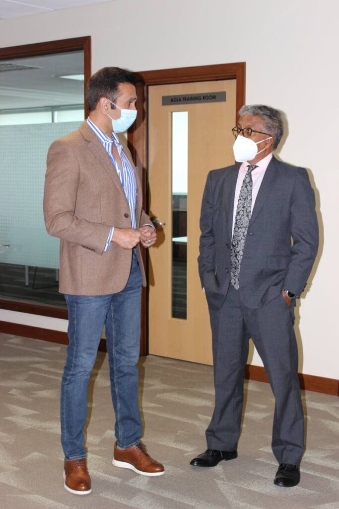 New Attorney General Reginald Amour is greeted by his predecessor Faris Al-Rawi at the Ministry of the Attorney General and Legal Affairs (AGLA), Government Plaza, Port of Spain on Thursday. PHOTO COURTESY AGLA 