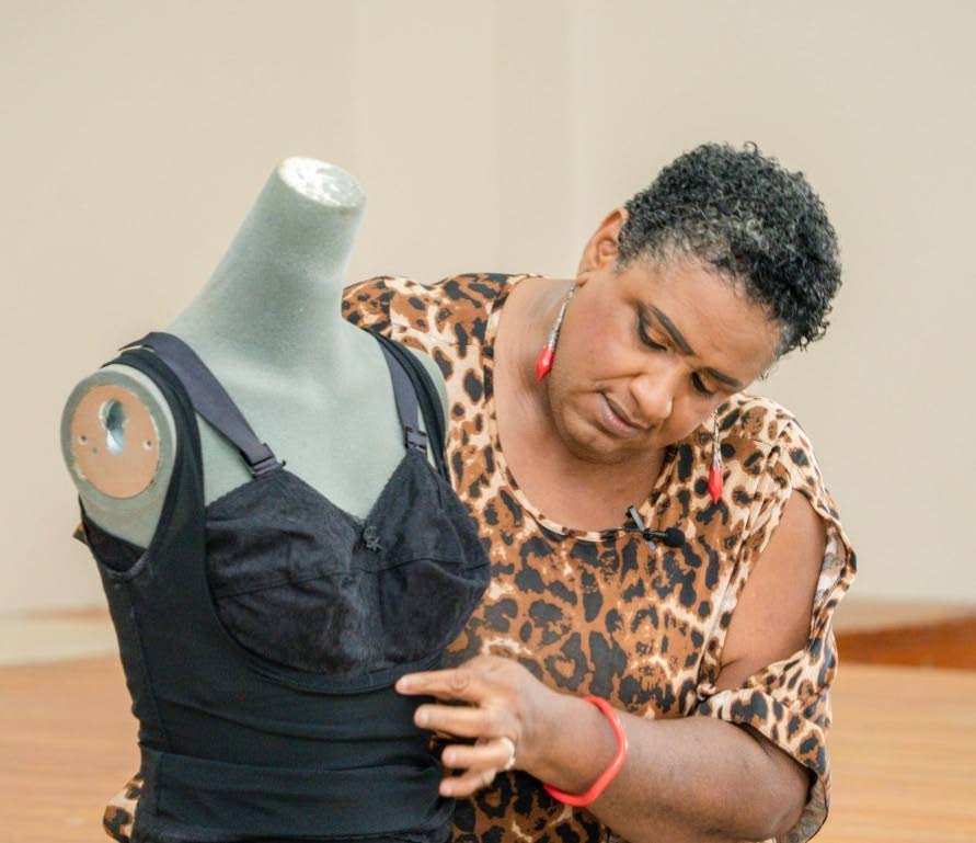 Breast health educator Ora Gordon talks to women in the programme on Wednesday about selecting the right bra. - THA