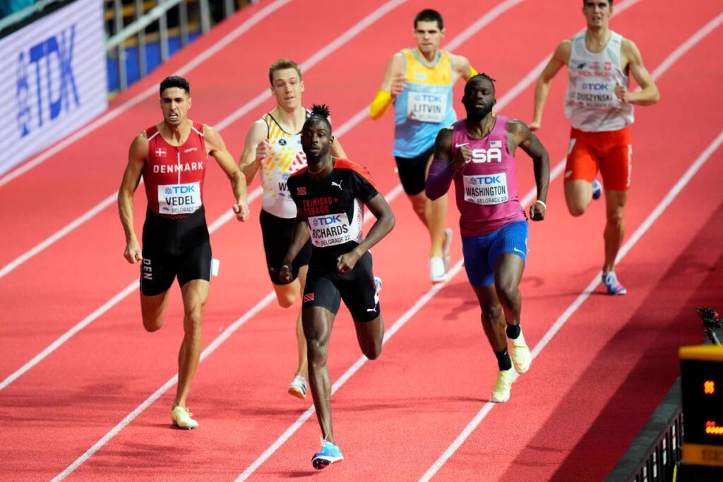 Jereem Richards, of Trinidad and Tobago (centre), wins a men's 400-metre semifinal at the World Athletics Indoor Championships in Belgrade, Serbia, on Friday. (AP PHOTO)  