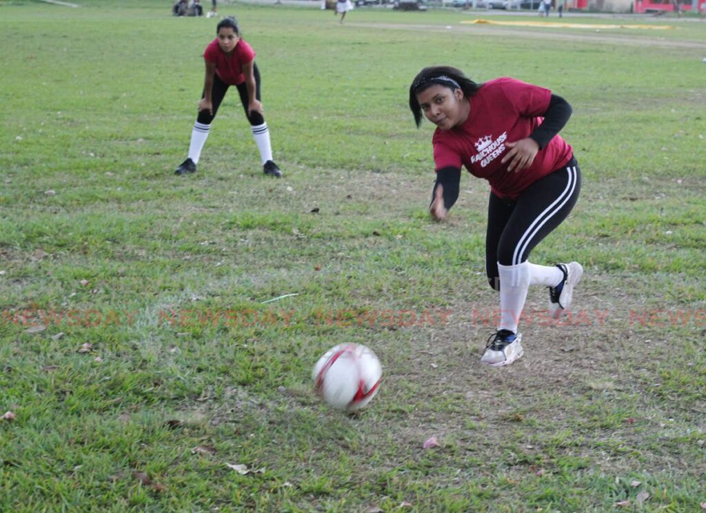 Ranchohouse Queens’ Eliannys Silva pitches during a kicking ball game, at the Curepe Savannah on Friday.  - ROGER JACOB