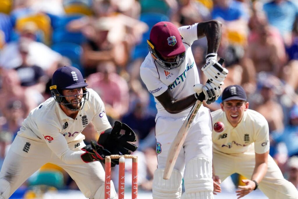 West Indies' captain Kraigg Brathwaite plays a shot under the watch of England's keeper Ben Foakes during day five of their second Test match at the Kensington Oval in Bridgetown, Barbados, on Sunday. (AP Photo) - 