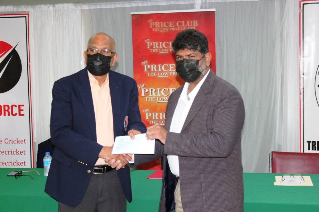 TTCB president Azim Bassarath, left, receives a $200,000 cheque from The Price Club managing director Shamshad Ali for the upcoming U17 Youth Series Tournament which bowls off on Monday.  - Courtesy The Price Club
