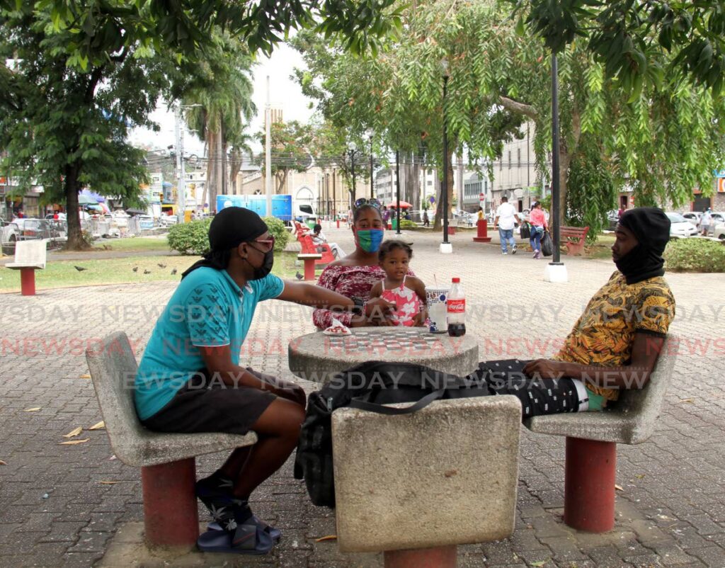 From left, Stephan Matthews, Shallima Sirjoo, her daughter, Akiva Alexander and Atiba Alexander took to the Brian Lara Promenade, Port of Spain to relax as the Promenade was re-opened for pedestrians - Ayanna Kinsale