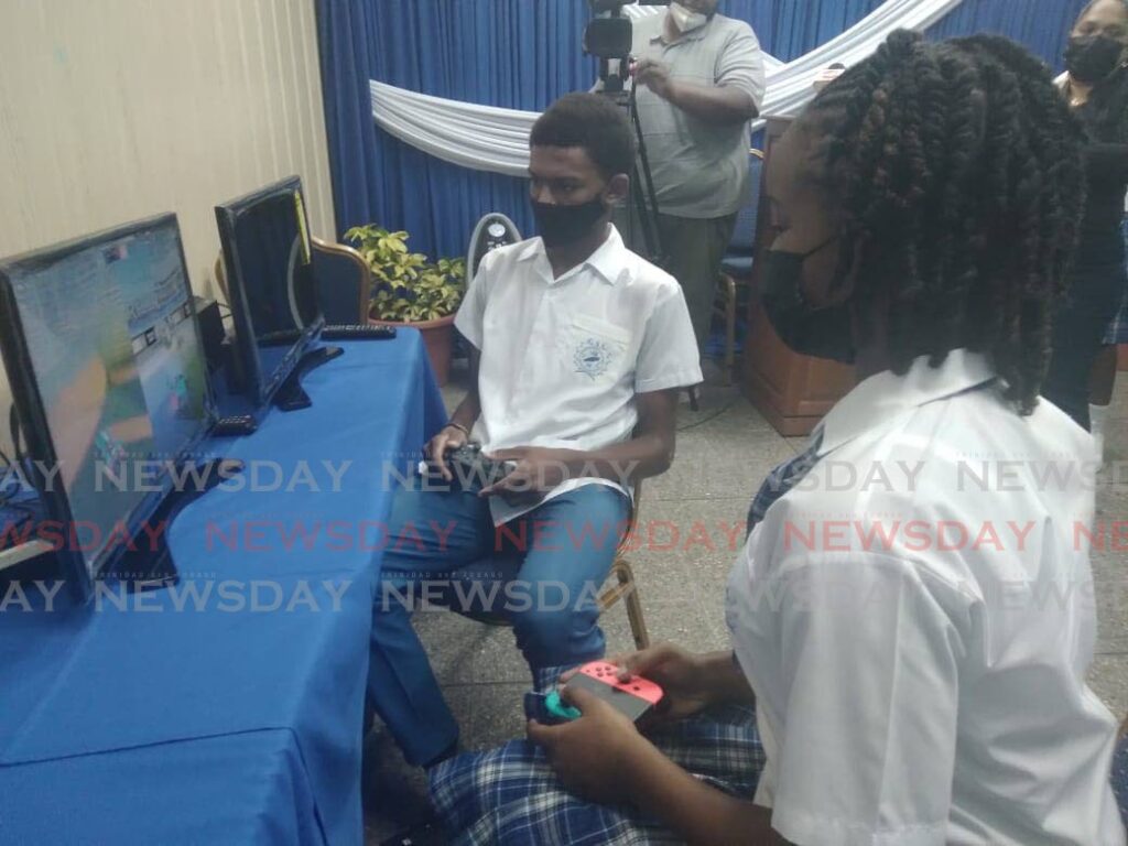 Mc Keda Waldron and Ja-van Smith play a game at the launch of an e-sport initiative at the Goodwood Secondary School on Wednesday.
  - Corey Connelly