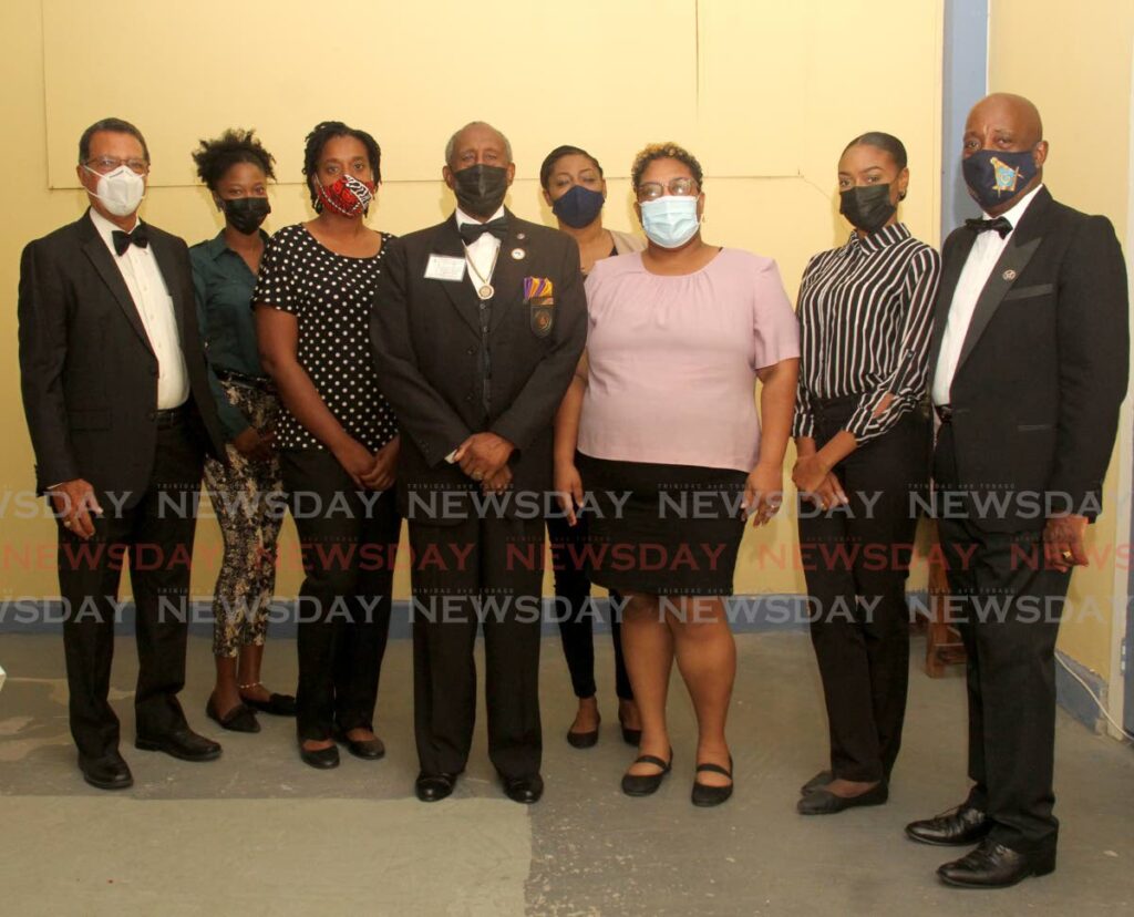 District Deputy grand master W.T Courtney Browne, centre, takes a photo from left, with treasurer Richard Morris,  Eileen St. Rose, Kathy-Anna Charles-Cooper, Rosanne Reid, Kelsy Seebaran Baxter, Starlet Lewis and junior warden Junior Hutson during the launch of the Freemasons Order of the Eastern Star Chapter on Pembroke Street, Port of Spain.  - AYANNA KINSALE