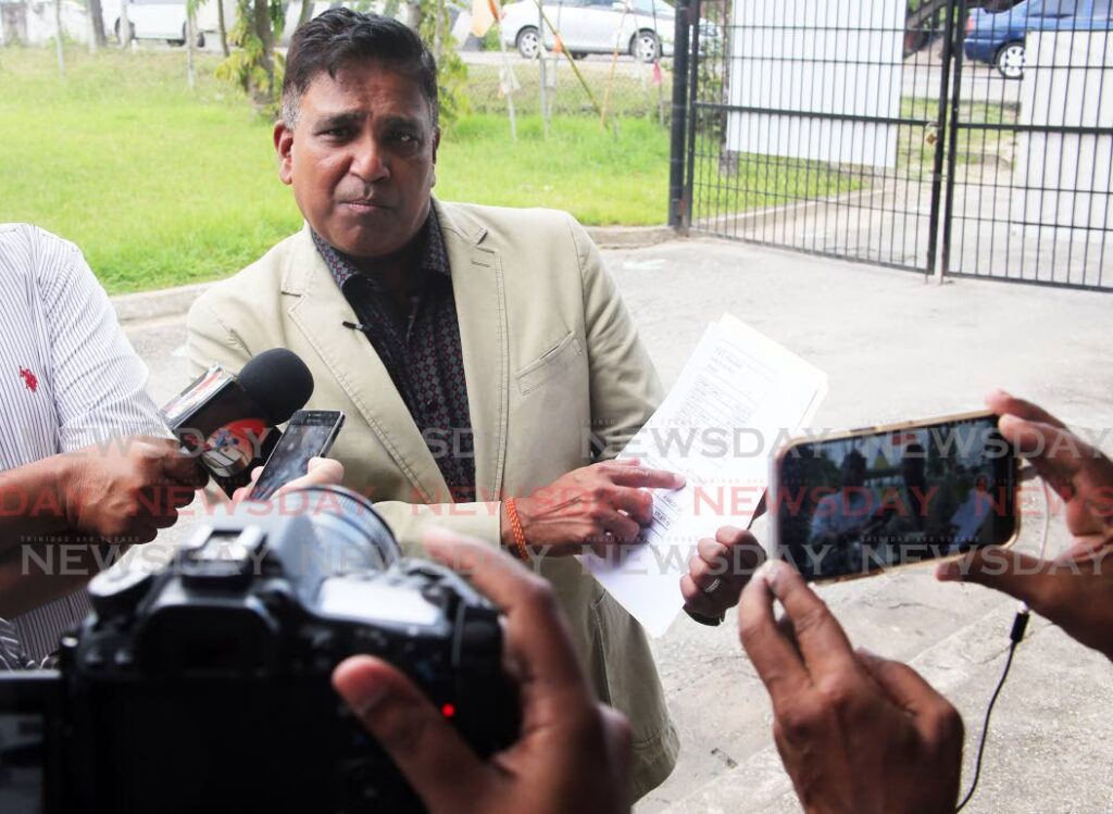 Oropouche East MP Dr Roodal Moonilal speaking with the media following a visit to the Debe Hindu SDMS primary school where he distributed school supplies and hand sanitisers to the SEA students. Photo by Lincoln Holder. 