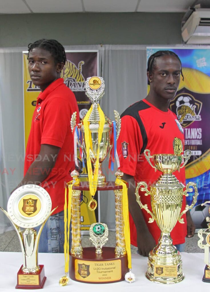 Trendsetter Hawks FA’s Malachai Celestine (L) and Caledonia AIA’s Nathaniel Babwah attend the launch, of the Tiger Tanks’ Under-20 football tournament, on Thursday, at the National Cricket Centre, Couva.  - Marvin Hamilton