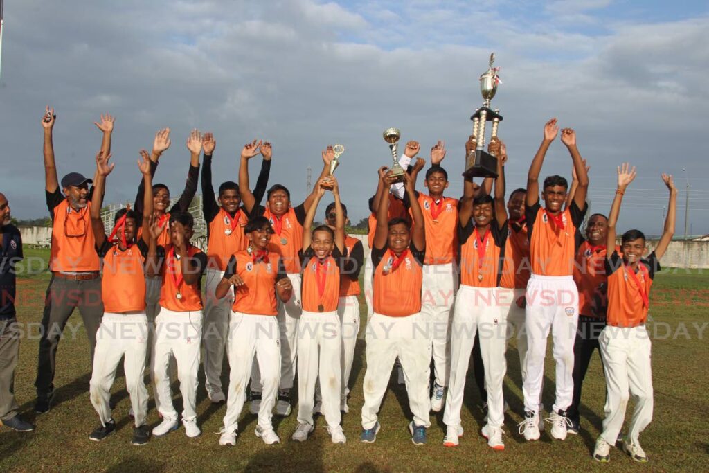 South East players celebrate being awarded the Scotiabank NextGen Under-15 cricket crown on Friday at the National Cricket Centre, Balmain, Couva.  - Marvin Hamilton