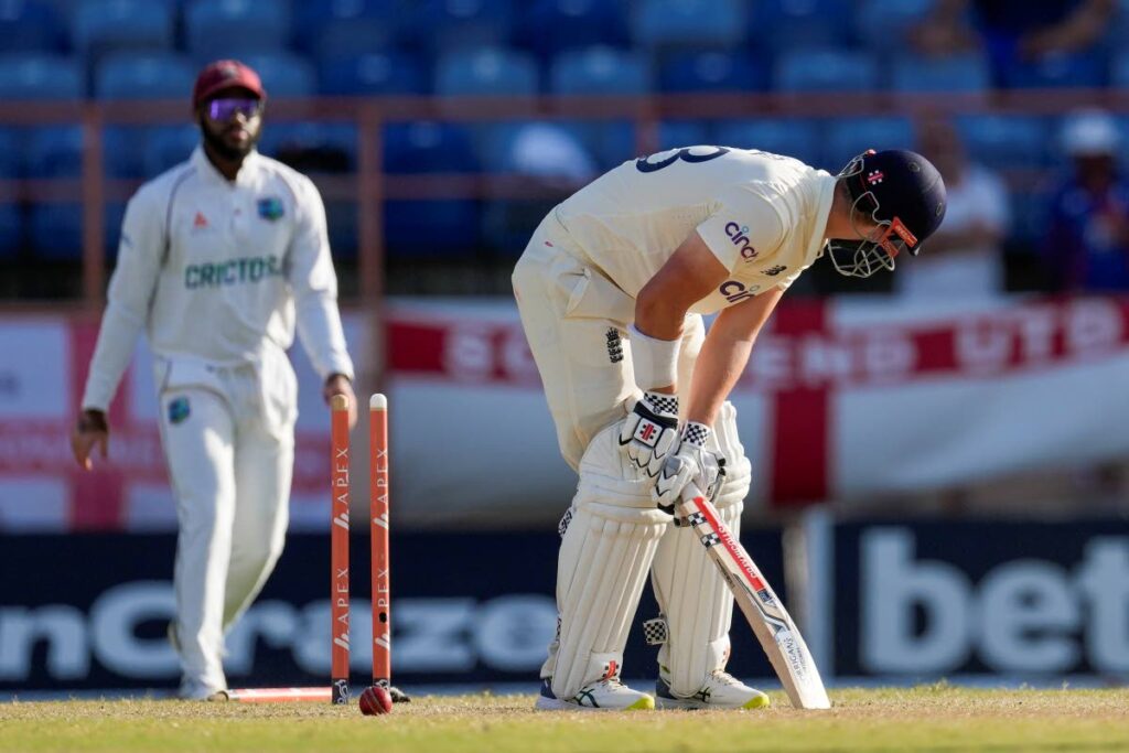 England's Alex Lees looks down after being bowled by West Indies' Kyle Mayers during day three of their third Test match at the National Cricket Stadium in St. George, Grenada, on Saturday. - 