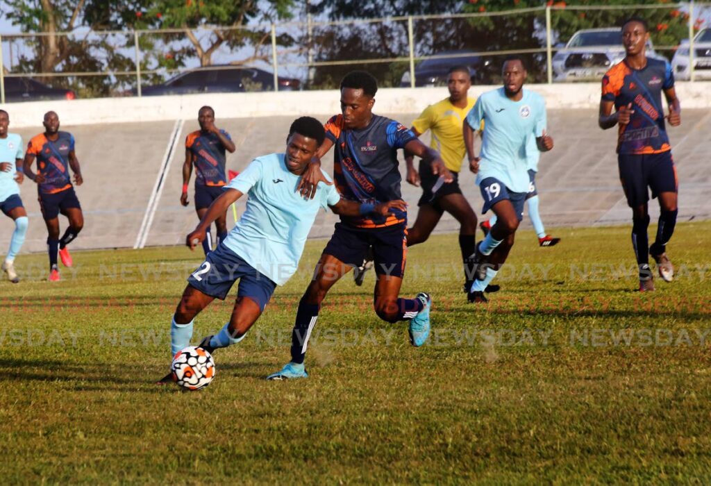 Police player Tyrese Bailey ( L) vies for control of the ball as Deportive Point Fortin’s Eziekiel Kessar (R) defends, during the Ascension League football match, at the Arime Veledrome on Saturday. - SUREASH CHOLAI