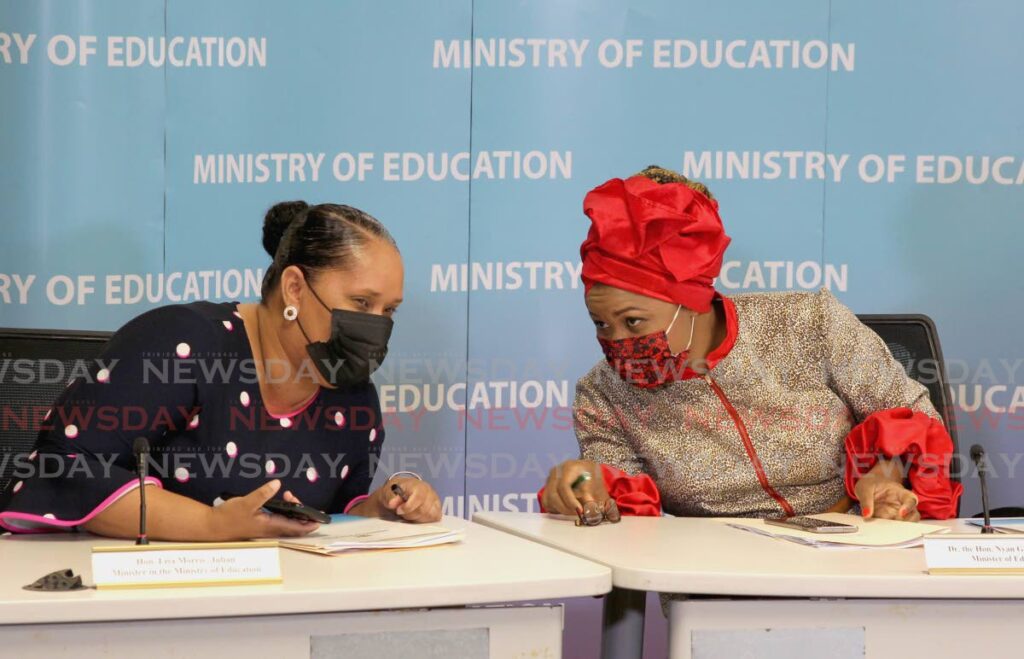 YES MISS: Minister of Education Dr Nyan Gadsby-Dolly speaks with minister in the ministry Lisa Morris-Julian during a news conference at the ministry in Port of Spain on Monday to announced the plans for the full reopening of schools. - ROGER JACOB