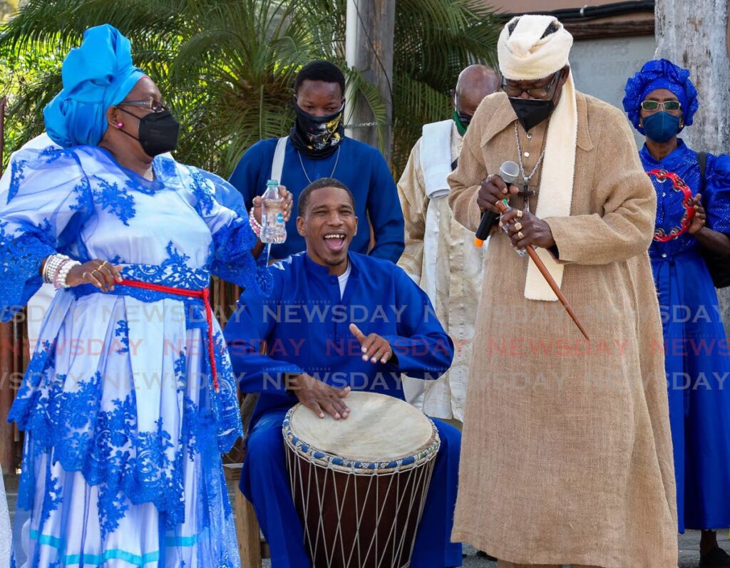 Tobago United Spiritual Baptist Assembly members worship through song and dance on Spiritual Shouter Baptist Liberation Day on Wednesday at the old Scarborough car park. - David Reid