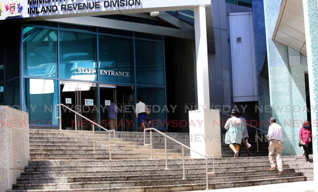 In this file photo public servants head to work at the Inland Revenue Division, Port of Spain.