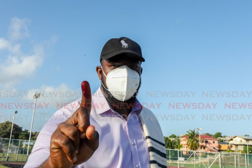 FILE PHOTO: Shomari Hector shows his finger after voting in the THA elections in January last year. - 