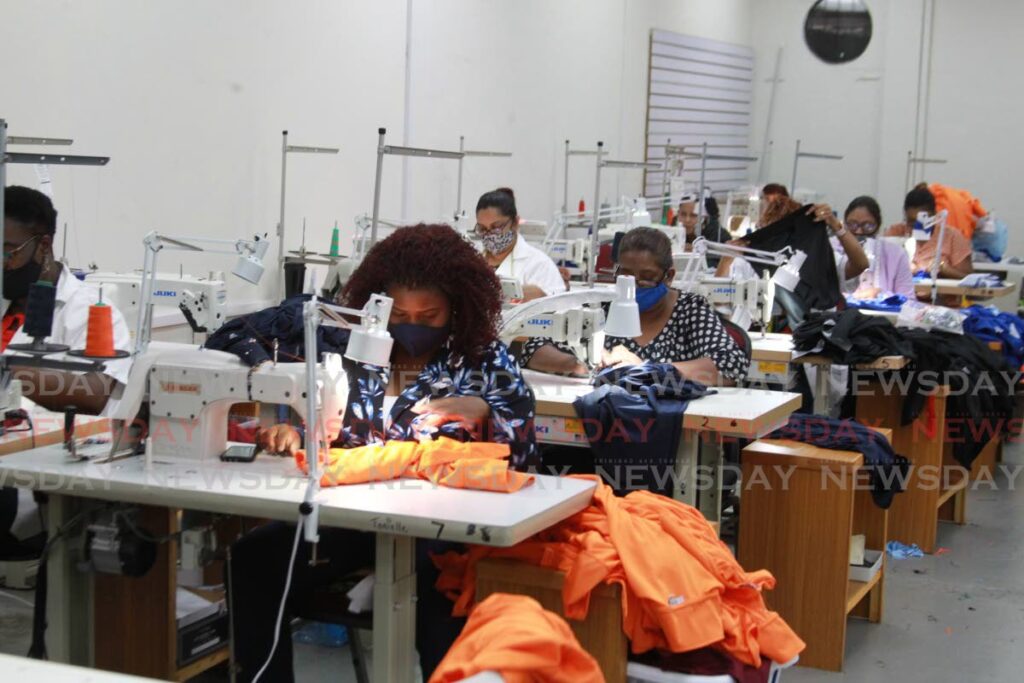 In this April 2021 file photo, employees work at the sewing station at Lazuri Apparel's factory in Barataria. Photo by Roger Jacob
