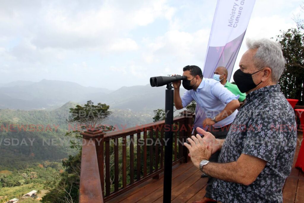 FILE PHOTO: Minister of Tourism, Culture and the Arts Randall Mitchell looks through a pair of binoculars at Saut D'Eau from the La Vigie Paramin Lookout on February 16 as Minister of Finance Colm Imbert looks on. - Photo by Ayanna Kinsale