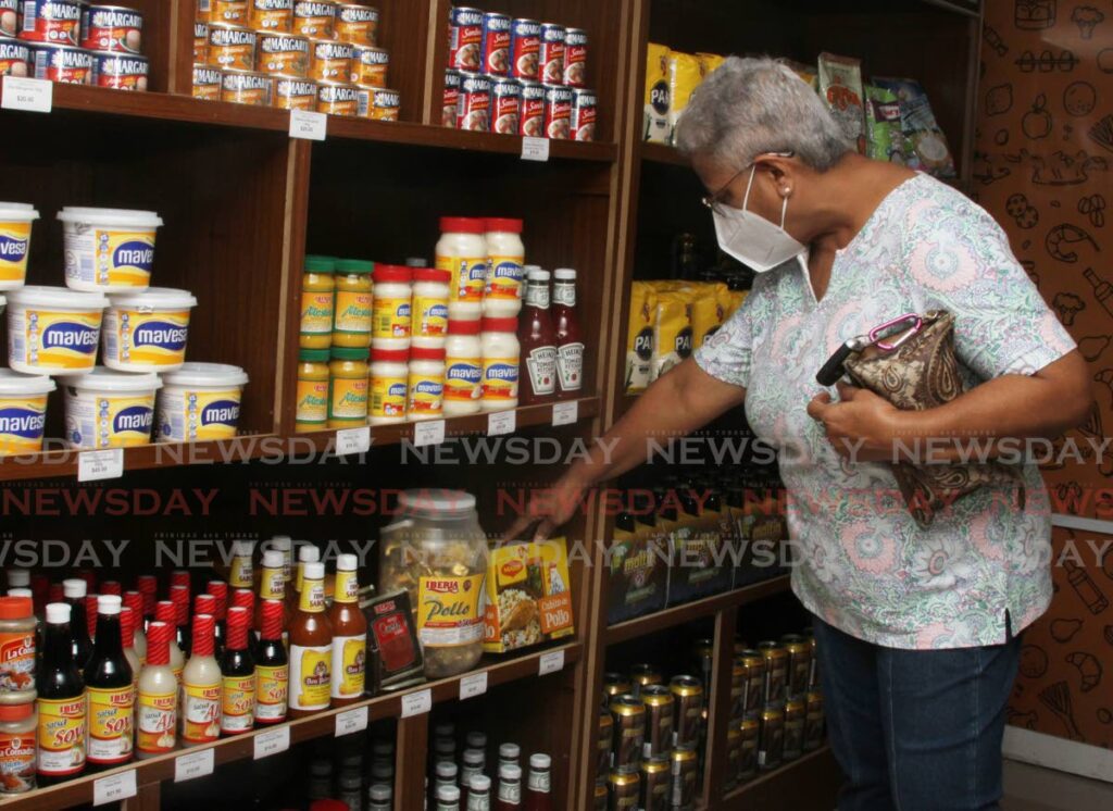 Ann Marie Radhay shops at La Bodega grocery inside Bell Peppers Supermarket, Temple Road, Couva. Photo by Angelo Marcelle