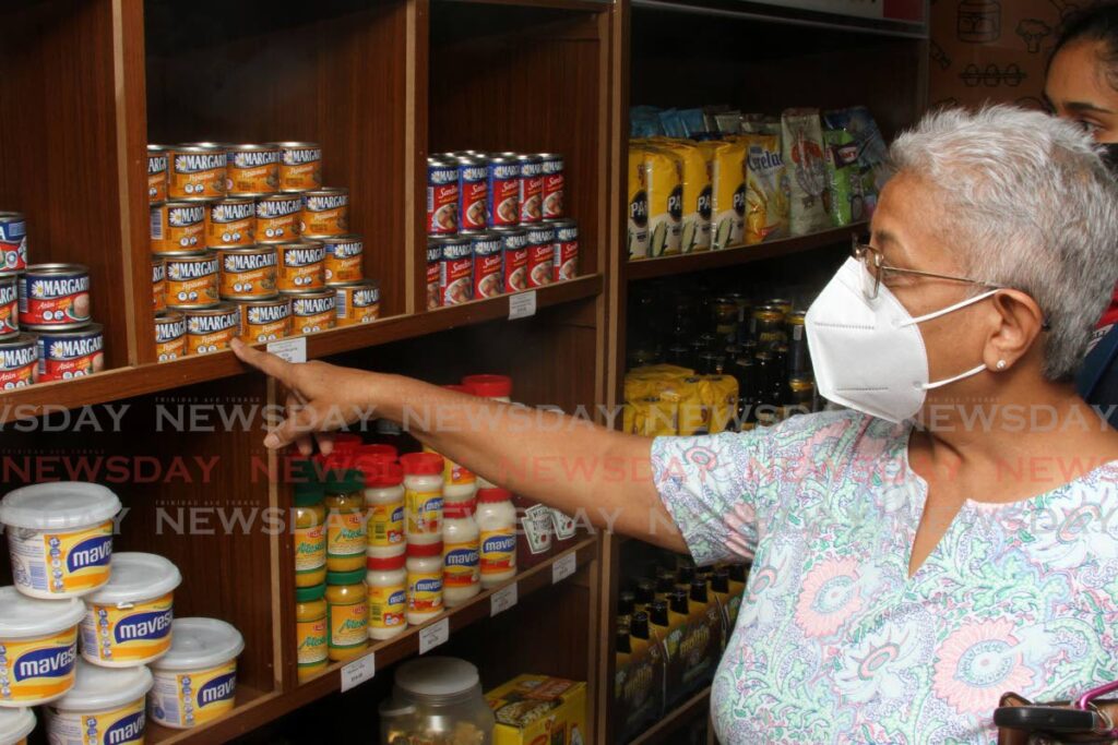 Ann Marie Radhay shops at La Bodega grocery inside Bell Peppers Supermarket, Temple Road, Couva. - Photo by Angelo Marcelle