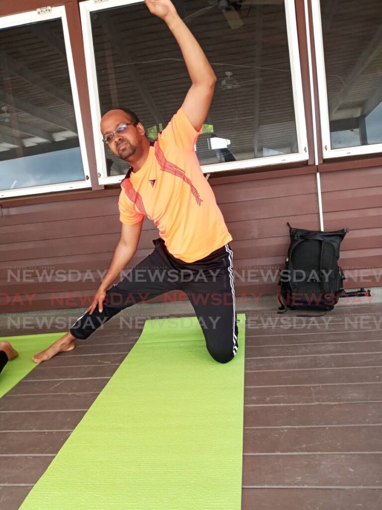 Jelani Beckles in some discomfort attempting a yoga pose.  - 