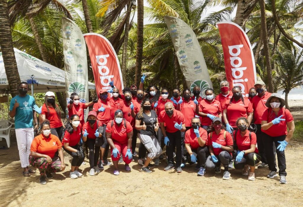 Tourism Trinidad Ltd's employees with executives of Nature Seekers at the start of the Matura beach clean up. - 