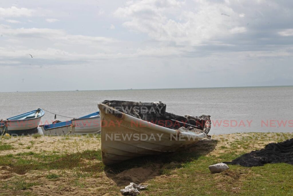 One of the boats torched at Carli Bay on March 28. - Photo by Marvin Hamilton