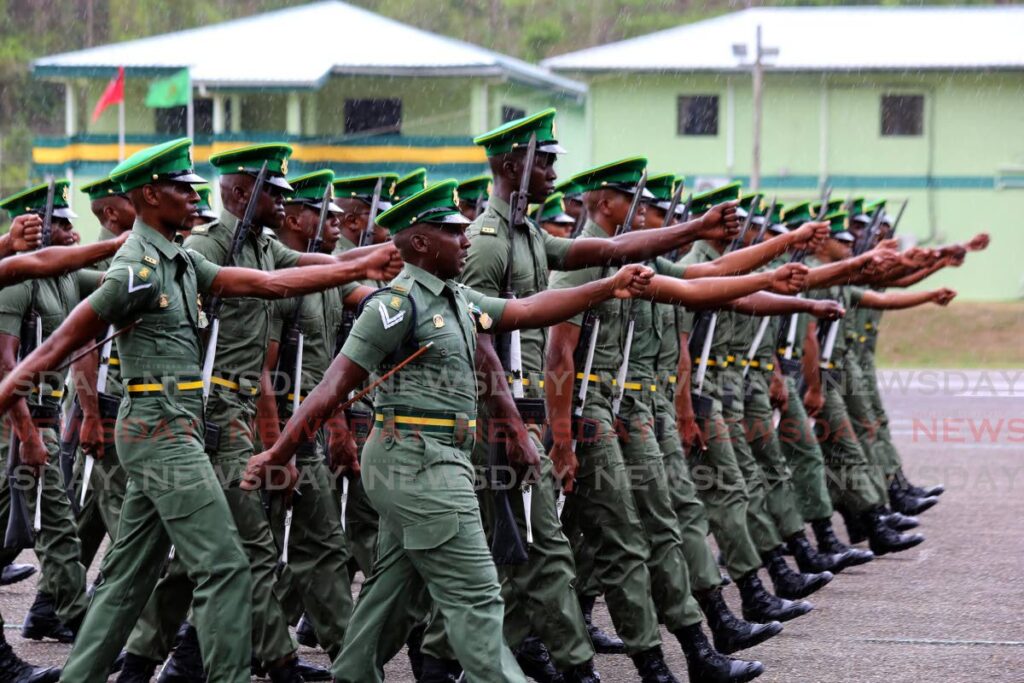 ON THE GO: New recruits march during the passing-out parade on Thursday at Teteron Barracks in Chaguaramas. PHOTOS BY SUREASH CHOLAI - 