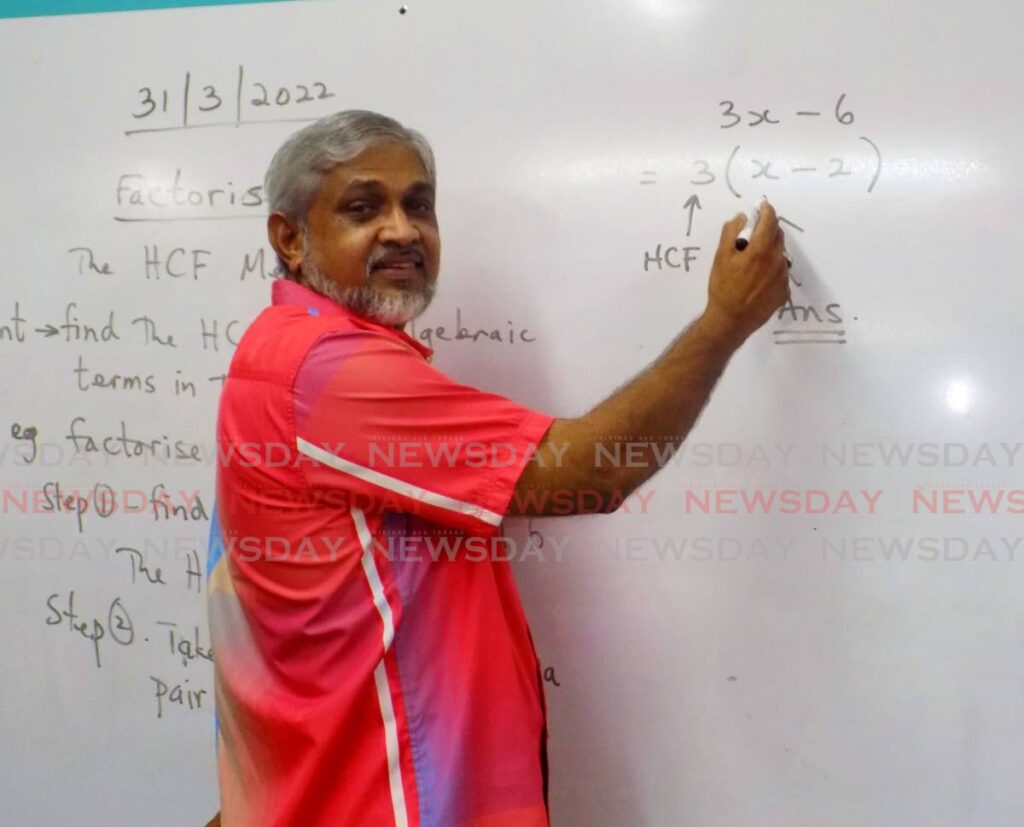 Mathematics teacher Shirazudeen Mohammed explains the steps behind a formula at Success Laventille Secondary School.
Mohammed is retiring after 29 years of teaching at the school. - Shane Superville