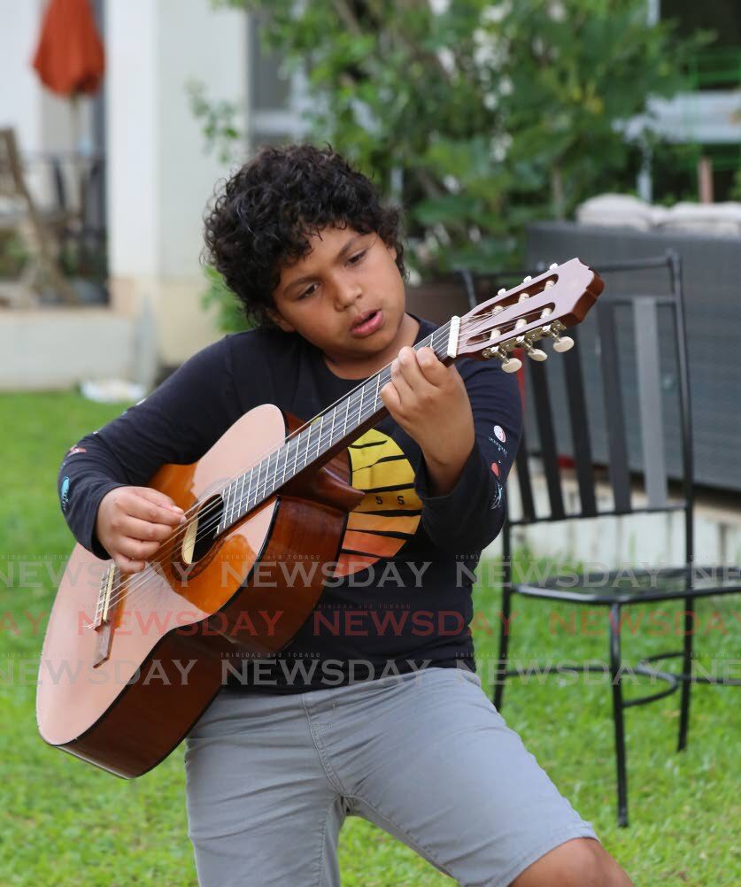 Josh Mohammed, 11, finds joy playing the guitar thumbnail