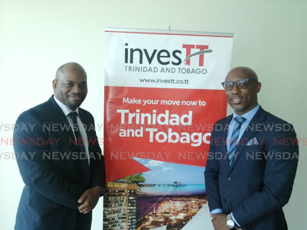 iQor vice president Dr William Huggins, left, and InvesTT president Sekou Alleyne at InvesTT's office in Port of Spain. Photo by Ryan Hamilton-Davis