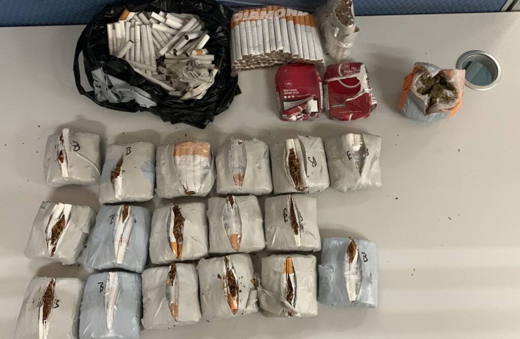 Police arrested a 50-year-old prison officer II who tried to smuggle 510 cigarettes and 70 grams of marijuana into the Port of Spain prison on Wednesday afternoon. 

Photo courtesy TTPS