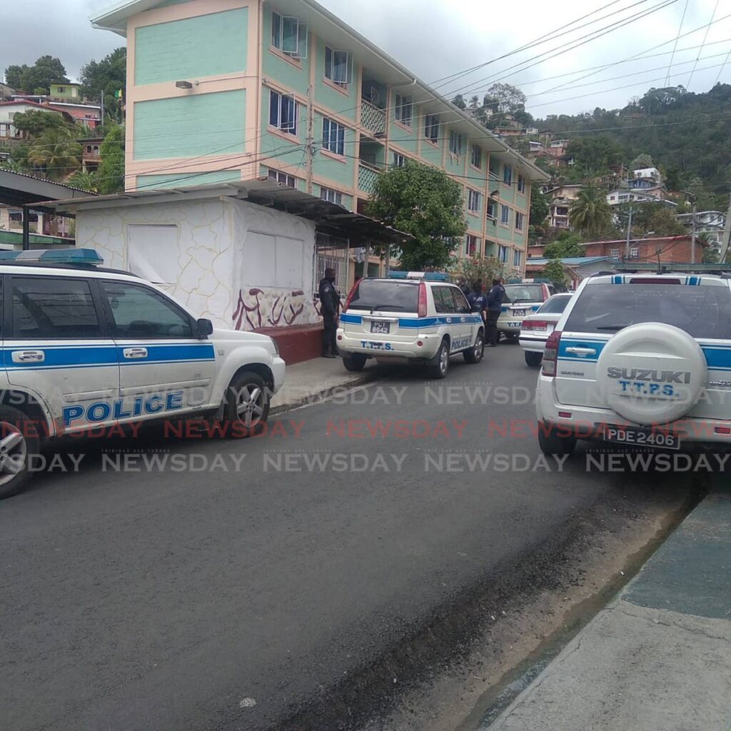 Police at Waterhole, Cocorite where a man was shot dead on Thursday morning. - 