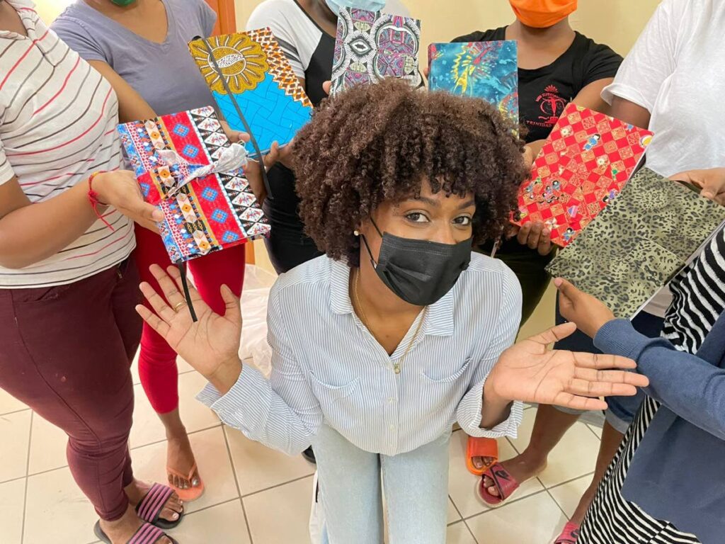 Bookbinder Akhela Guiseppi-Noel from Craftii Meraki poses with the young women of the Chosen Hands Art and Wellness programme at the St Jude’s Home for Girls after conducting a workshop on how to make hand-made journals and other stationery. This is one of the many workshops that Anika Plowden-Corentin co-ordinates to give the young women at St Jude’s the opportunity to seek entrepreneurship after leaving the home.

  - 