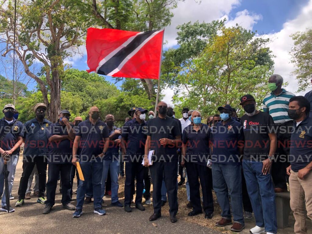 OWTU leader Ancel Roget , cenrtre, with Petrotrin retirees in front of Whitehall, Queen's Park Savannah on April 8. - Rhianna Mc Kenzie
