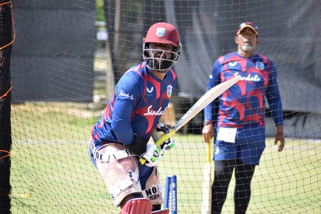 West Indies coach Phil Simmons (right) looks on as Raymon Reifer prepares to face a delivery during a practice session, at the Cricket West Indies’ white-ball camp, at the Coolidge Cricket Ground, Antigua, on Thursday. PHOTO COURTESY CRICKET WEST INDIES - 