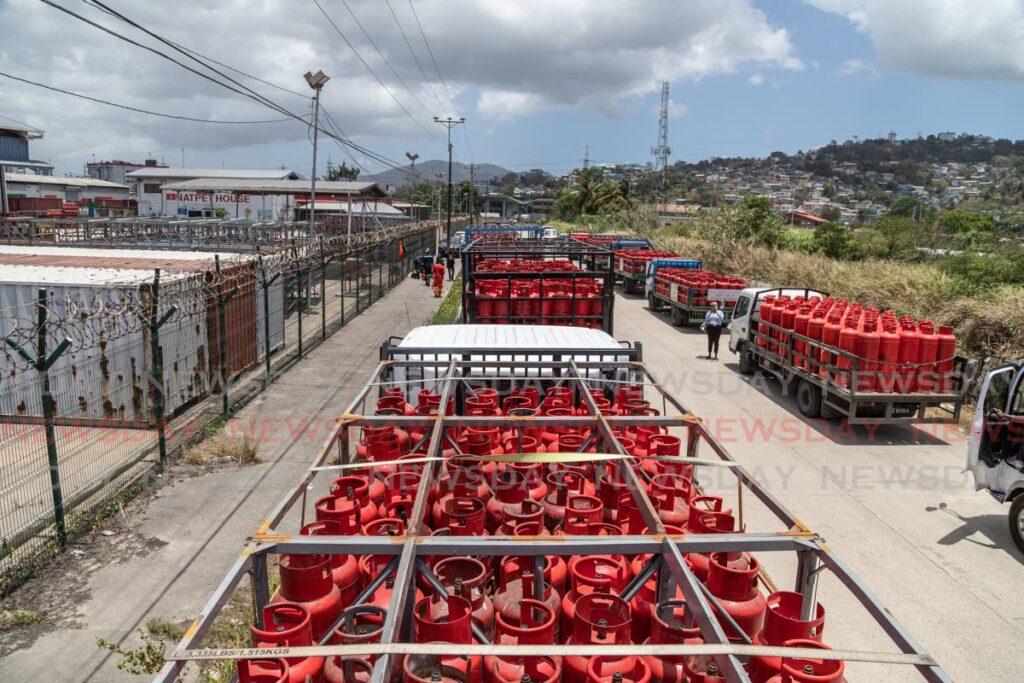 Long lines of trucks, filled with empty cooking gas tanks, wait outside NP at Sea Lots, Port of Spain on Wednesday. Photo by Jeff K Mayers