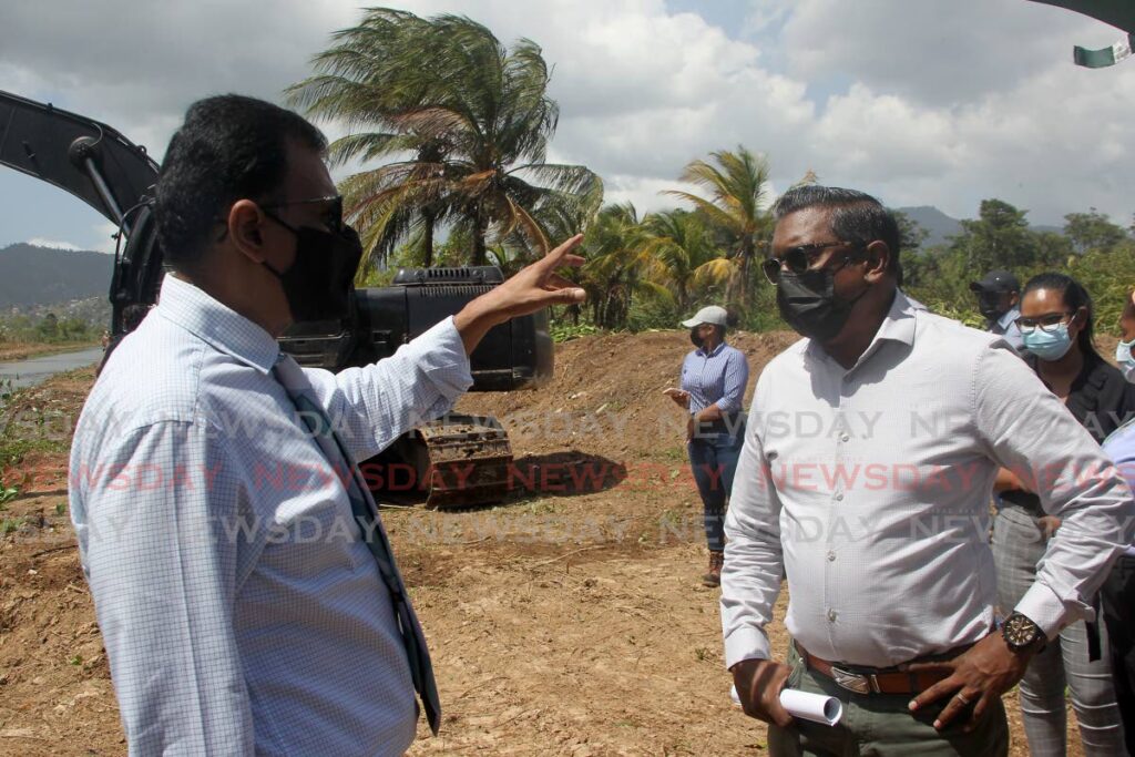 Minister of Works and Transport Rohan Sinanan, left, speaks with Nathaniel Nidkan, the ministry's District Superintendent North, during the tour. PHOTO BY ROGER JACOB - 