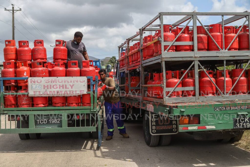 Workmen load trucks with cooking gas tanks at the NP distribution centre in Sea Lots, Port of Spain. Photo by Jeff Mayers